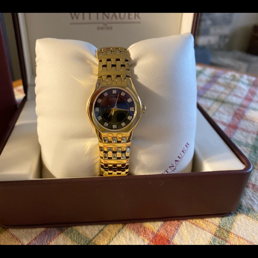 Wittnauer Laureate collection ladies  gold tone diamond bracelet style watch.